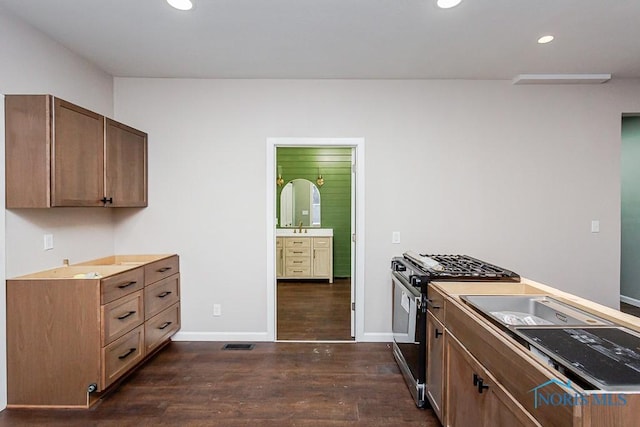 kitchen with range with gas cooktop and dark hardwood / wood-style floors