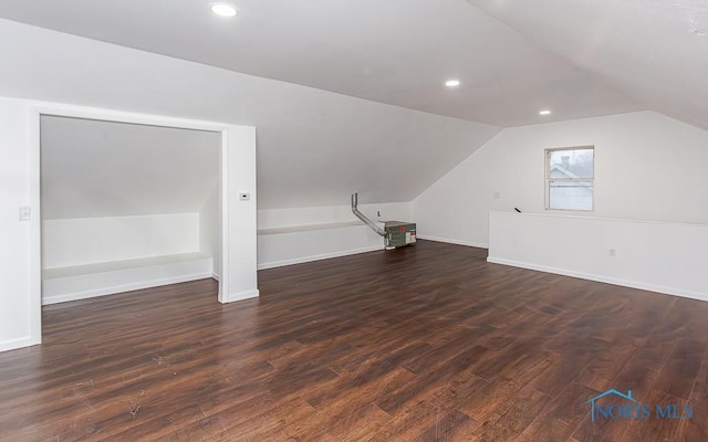 bonus room featuring vaulted ceiling and dark hardwood / wood-style floors