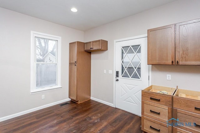 kitchen with dark hardwood / wood-style flooring