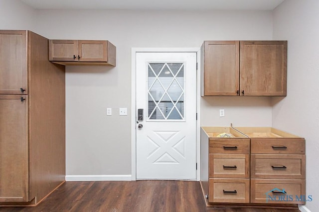 kitchen with dark hardwood / wood-style flooring