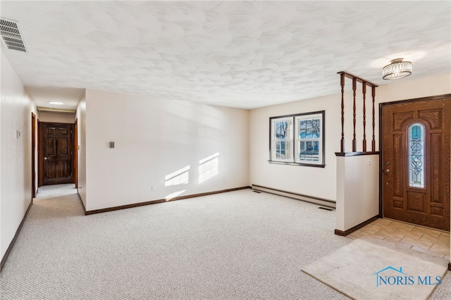 carpeted entrance foyer featuring a baseboard radiator