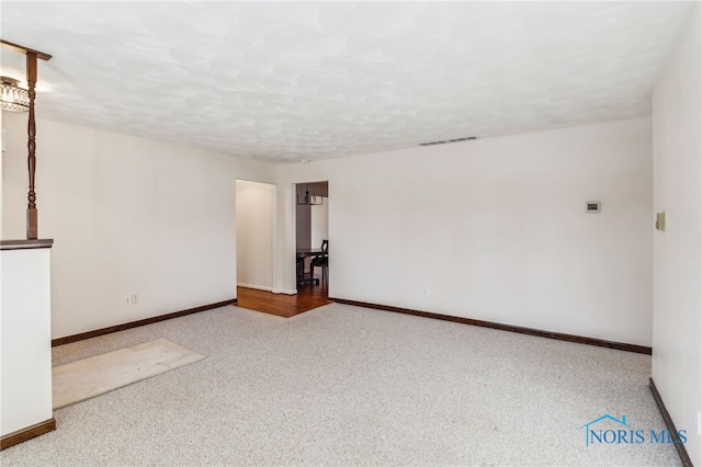 unfurnished room with carpet floors