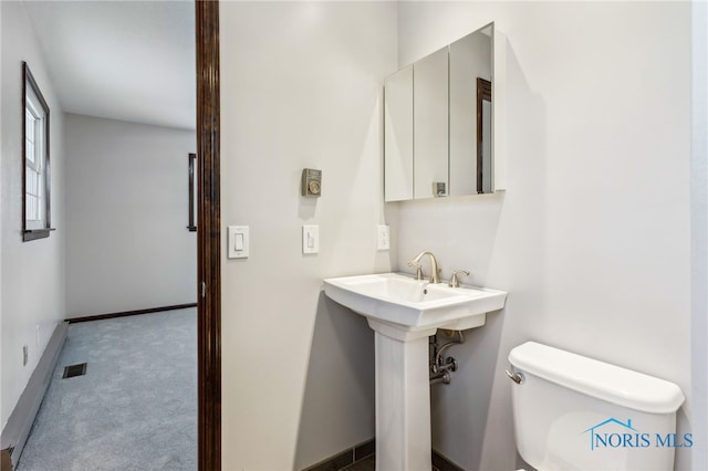 bathroom featuring toilet