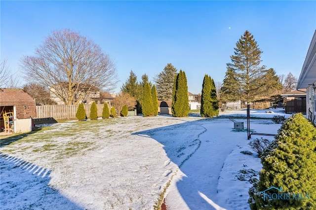 view of yard layered in snow