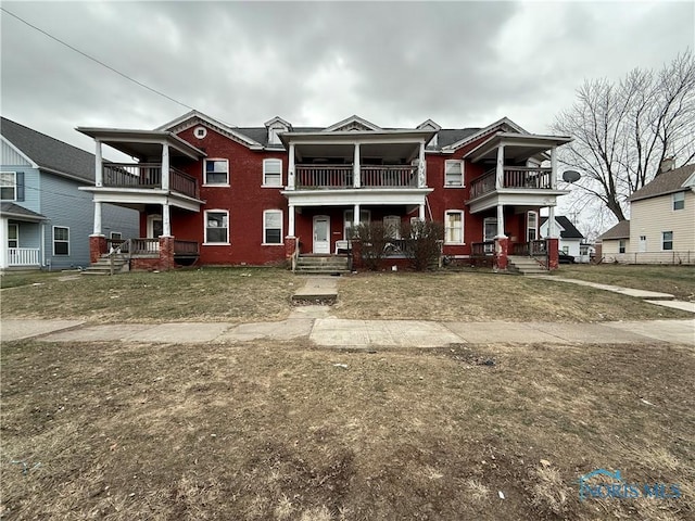 view of front of property with a balcony