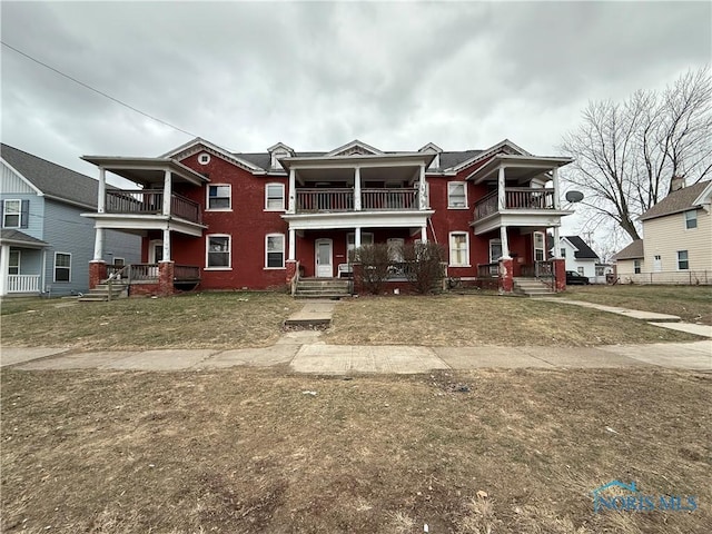 view of front of home with a balcony