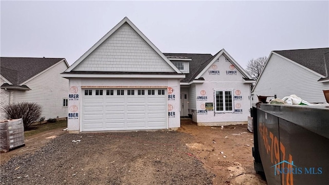 view of front of property with a garage