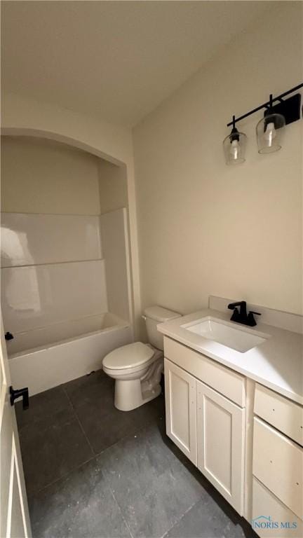 full bathroom with vanity, bathing tub / shower combination, and toilet