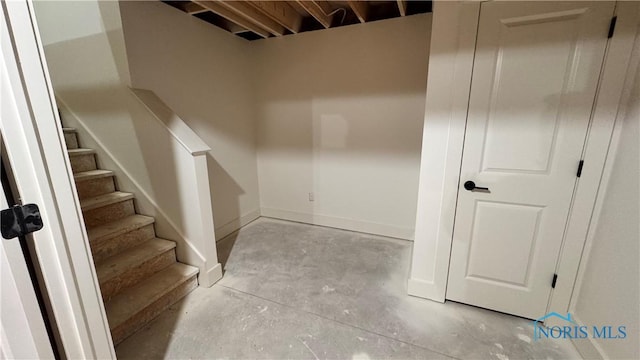 stairway with concrete floors