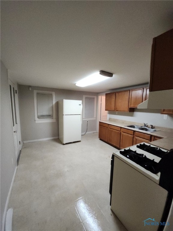 kitchen with white appliances and sink