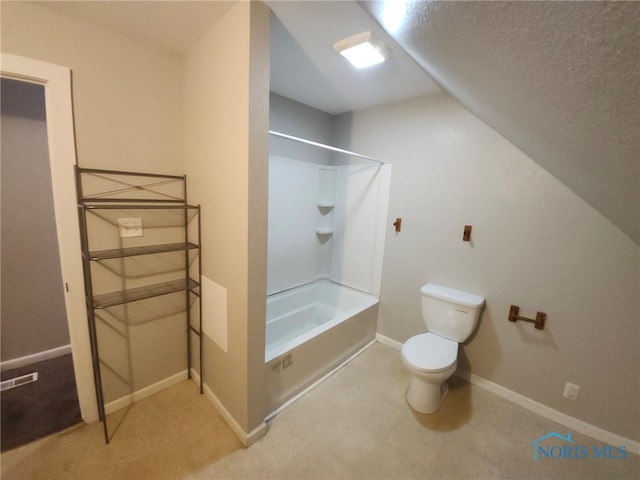 bathroom featuring washtub / shower combination and toilet