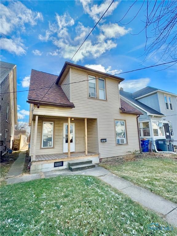 view of front of home with a front lawn and a porch