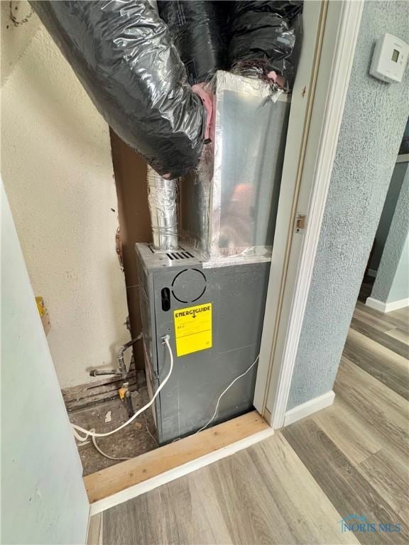 utility room with heating unit