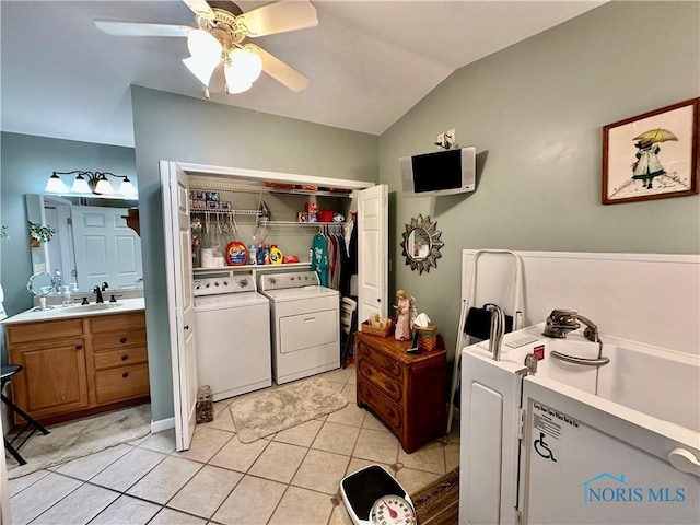 clothes washing area featuring light tile patterned floors, separate washer and dryer, ceiling fan, and sink