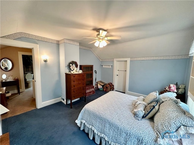 carpeted bedroom with vaulted ceiling and ceiling fan