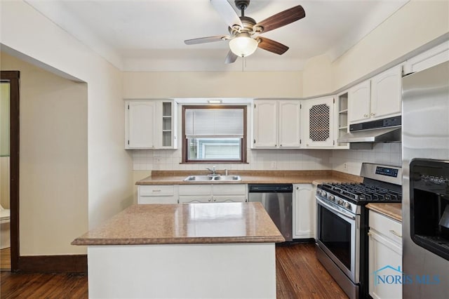 kitchen featuring white cabinets, appliances with stainless steel finishes, and a kitchen island