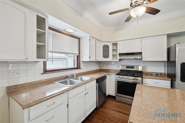 kitchen with sink, white cabinetry, dark hardwood / wood-style floors, and stainless steel appliances