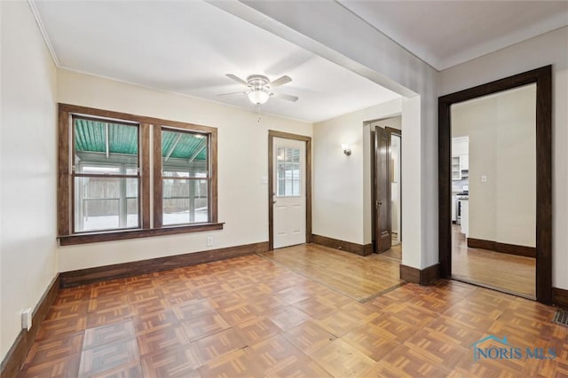 entryway featuring ceiling fan and parquet flooring