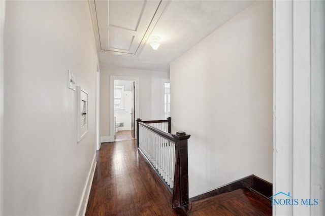 hall with hardwood / wood-style floors