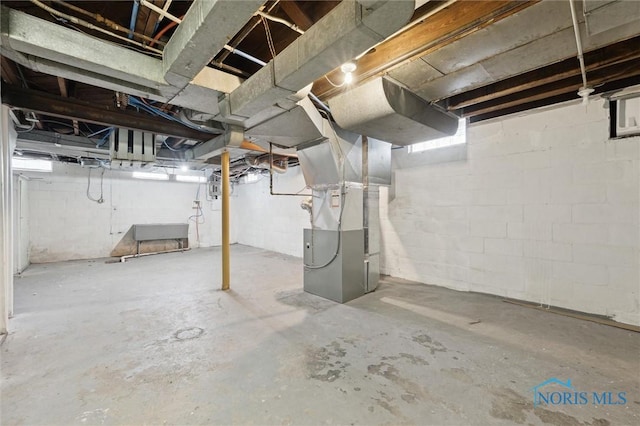 basement featuring heating unit