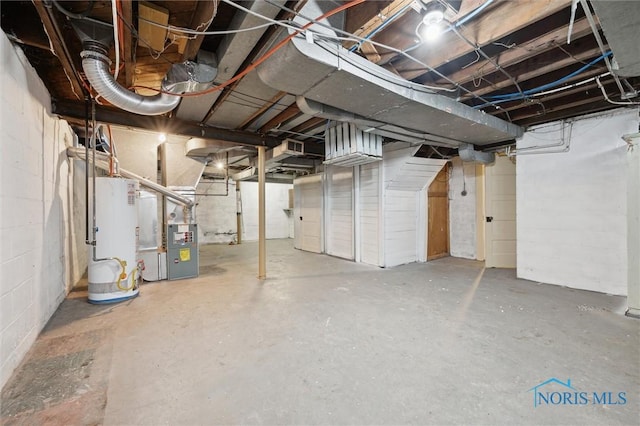 basement with heating unit and water heater