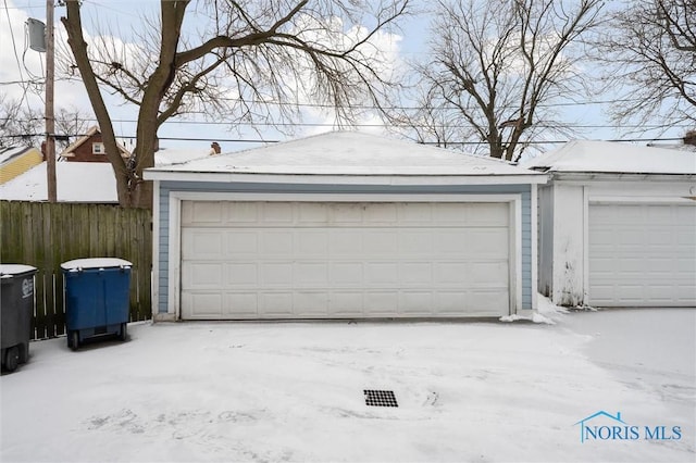 view of snow covered garage