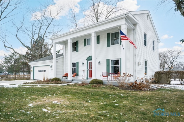 view of front facade featuring a garage and a front lawn