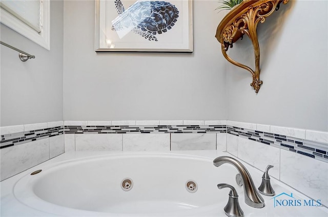 bathroom with a tub to relax in