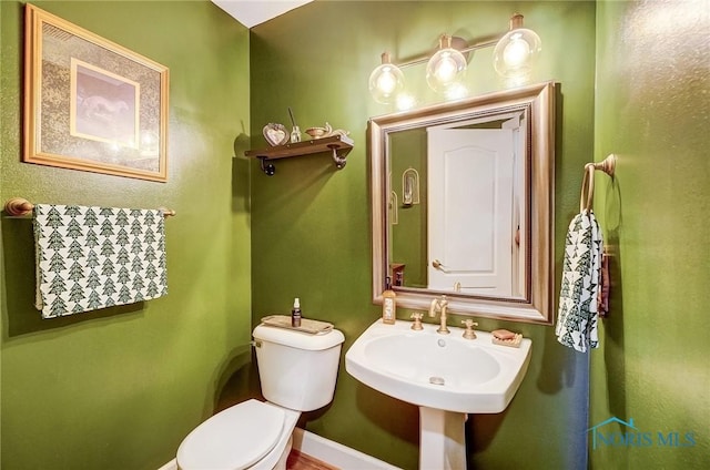 bathroom with sink and toilet