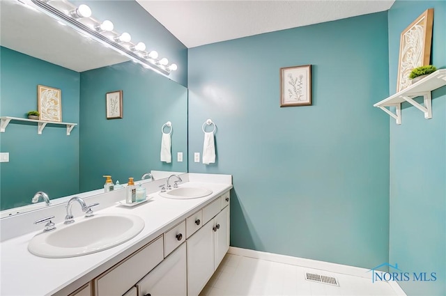 bathroom featuring vanity and tile patterned flooring