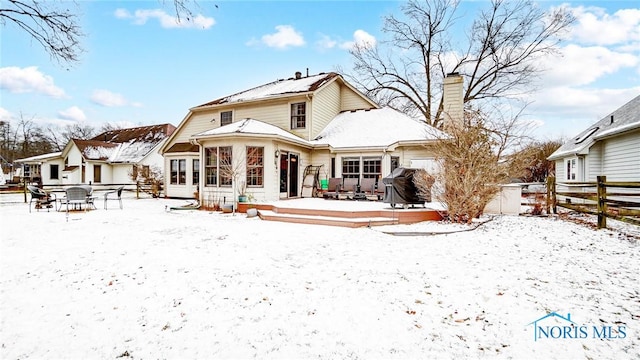 view of snow covered house