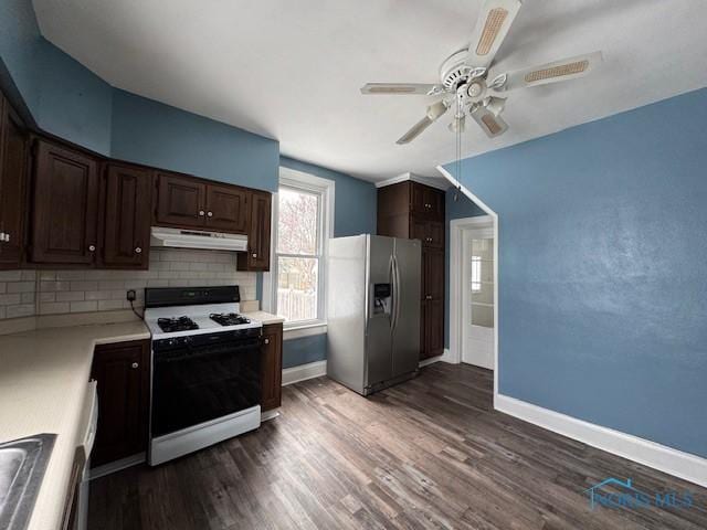 kitchen with tasteful backsplash, ceiling fan, white range with gas stovetop, stainless steel fridge with ice dispenser, and dark hardwood / wood-style floors