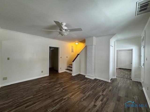 interior space featuring ceiling fan and dark hardwood / wood-style flooring