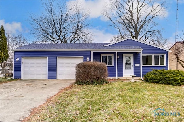 single story home with a front yard and a garage