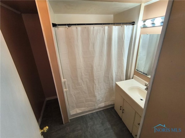 bathroom featuring hardwood / wood-style flooring and vanity