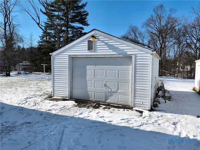 view of snow covered garage