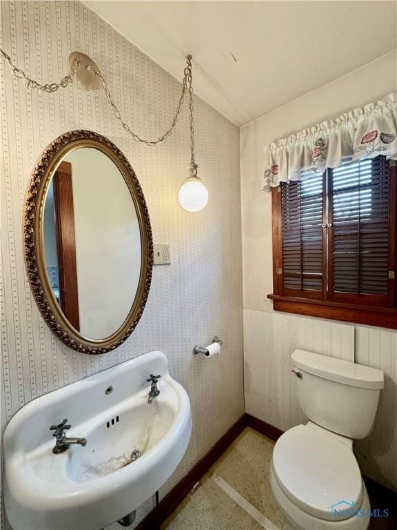 bathroom featuring sink and toilet