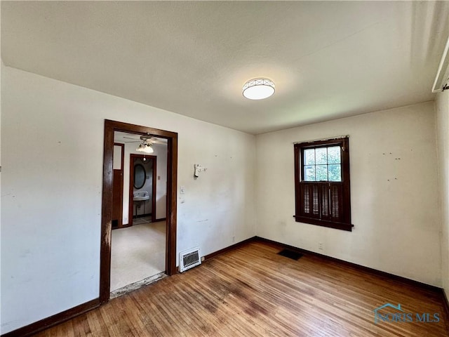 unfurnished room featuring hardwood / wood-style floors