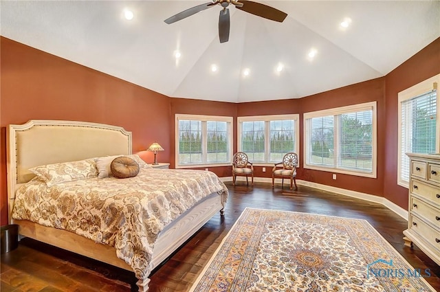 bedroom with ceiling fan, dark wood-type flooring, and lofted ceiling