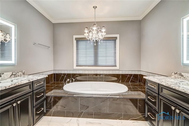 bathroom featuring vanity, a relaxing tiled tub, ornamental molding, and a notable chandelier