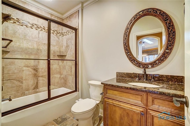 full bathroom with shower / bath combination with glass door, vanity, and toilet