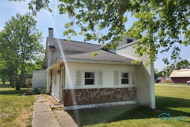 view of home's exterior featuring a lawn