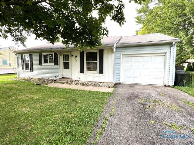 single story home with a front lawn and a garage