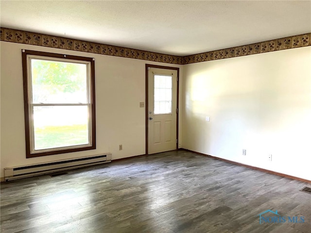 interior space featuring a baseboard radiator and dark hardwood / wood-style floors