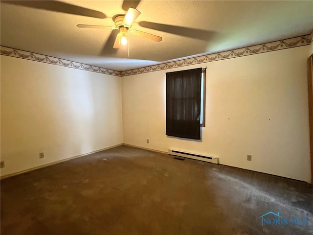 unfurnished room featuring ceiling fan, dark carpet, and a baseboard heating unit