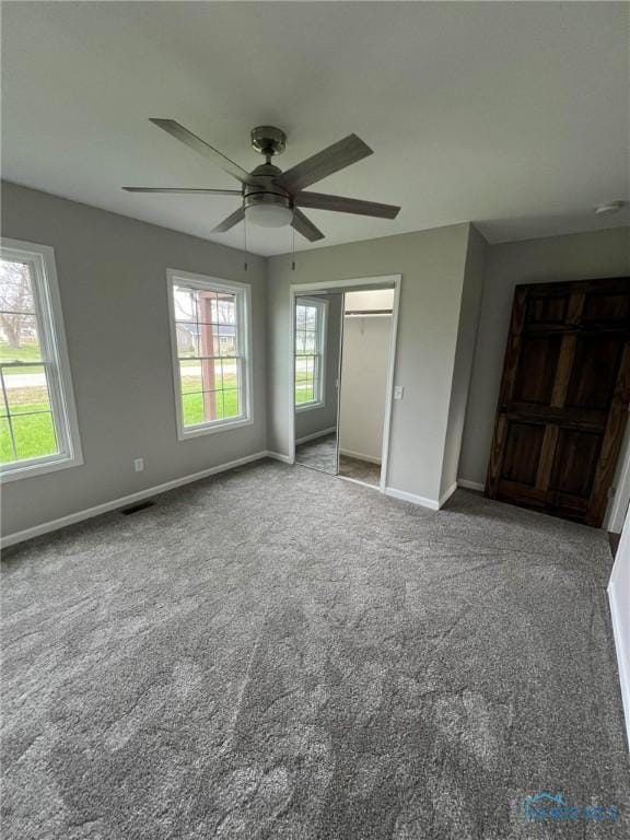 interior space with ceiling fan, a closet, and carpet