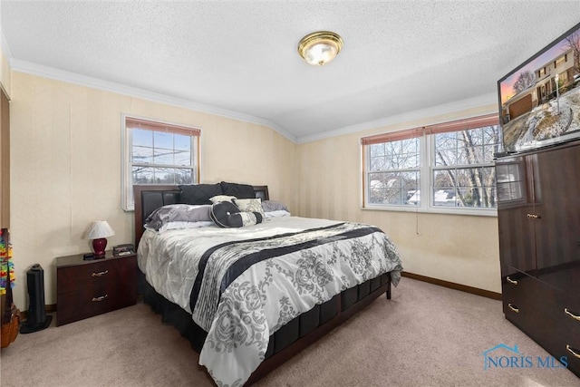 carpeted bedroom with lofted ceiling, ornamental molding, and a textured ceiling