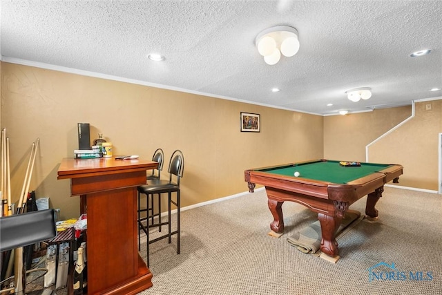 game room featuring ornamental molding, a textured ceiling, pool table, and carpet floors