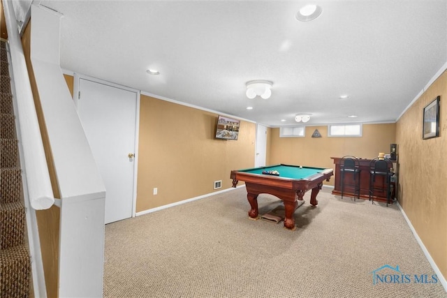 game room featuring carpet flooring, crown molding, pool table, and indoor bar