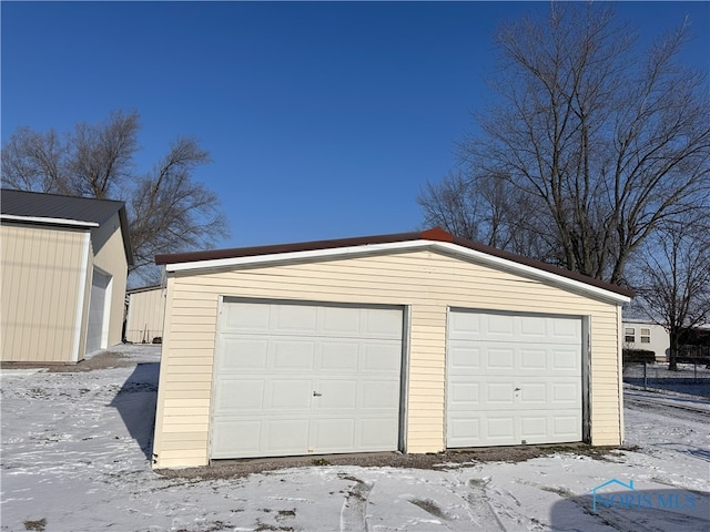 view of snow covered garage